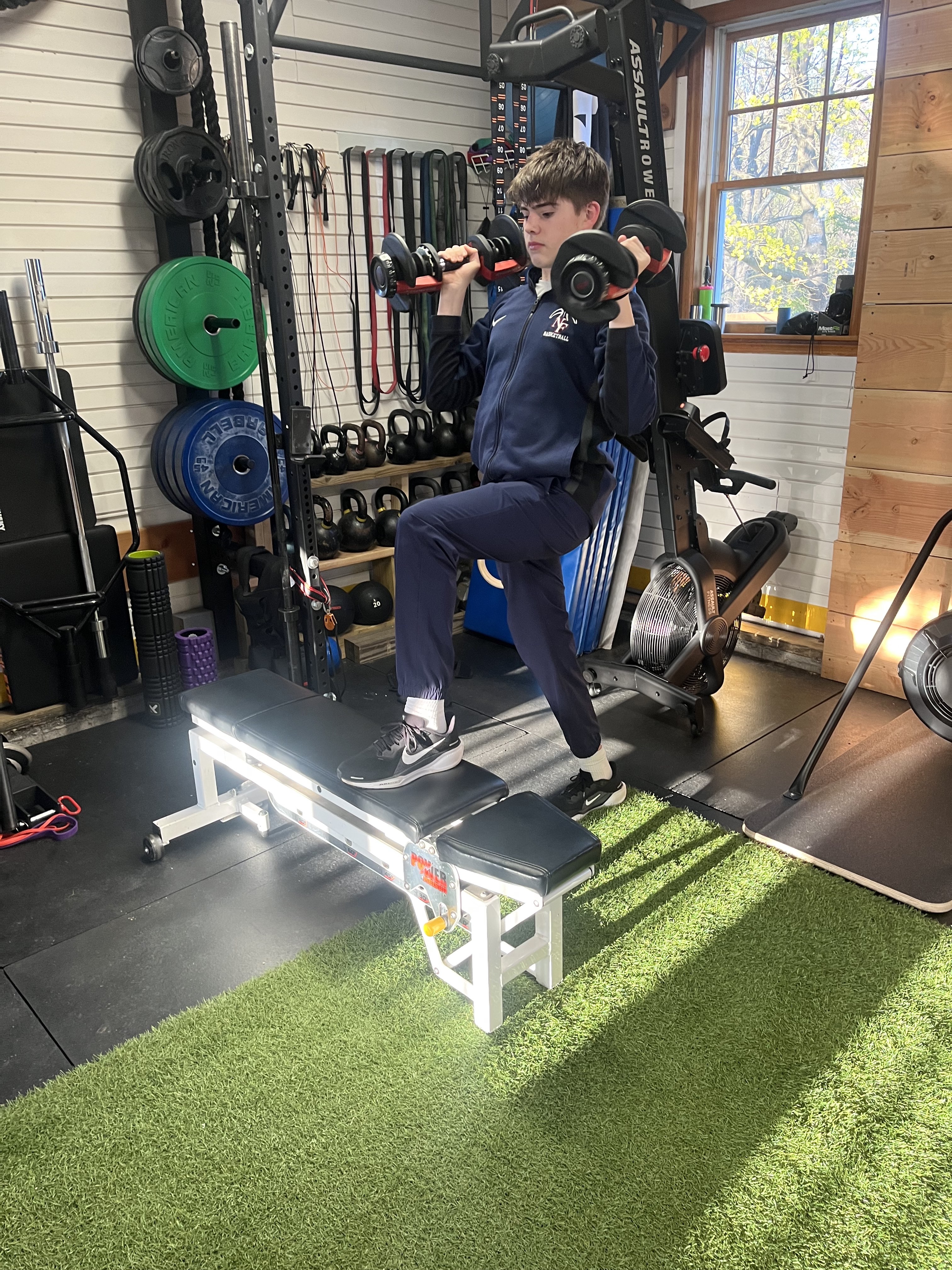 Athlete performing dumbbell shoulder press